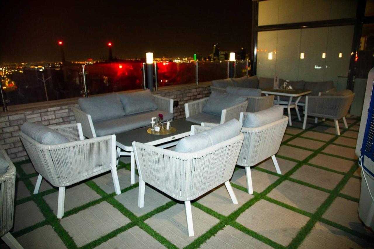 Saraya Corniche Hotel Doha Exterior photo Rooftop bar at the hotel